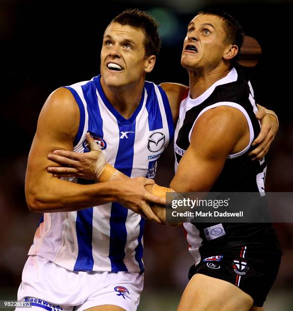 Hamish McIntosh of the Kangaroos contests a boundary throw in with Michael Gardiner of the Saints during the round two AFL match between the St Kilda...