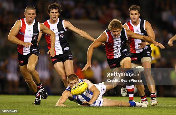 Sam Gilbert of the Saints competes for the ball against Lee Adams of the Kangaroos during the round two AFL match between the St Kilda Saints and the...