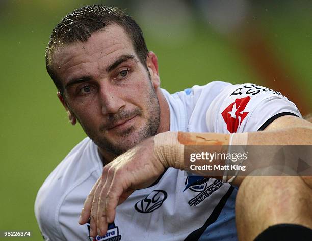 Luke Covell of the Sharks looks dejected after sustaining a leg injury during the round four NRL match between the Cronulla Sharks and the Parramatta...