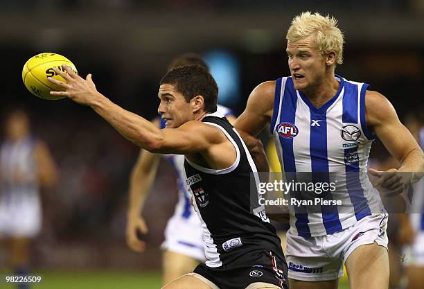 Leigh Montagna of the Saints wins the ball over Ben Warren of the Kangaroos during the round two AFL match between the St Kilda Saints and the North...