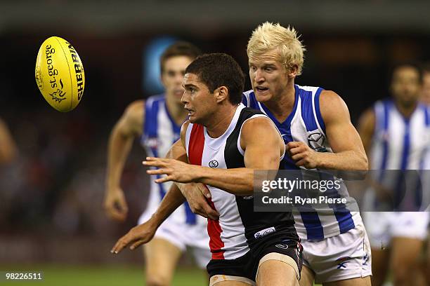 Leigh Montagna of the Saints competes for the ball against Ben Warren of the Kangaroos during the round two AFL match between the St Kilda Saints and...
