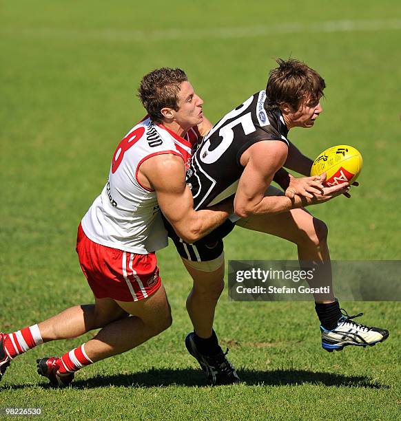 Callum Wilson of Swan Districts tackles Tim Geappen of South Fremantle during the round three WAFL match between Swan Districts and South Fremantle...