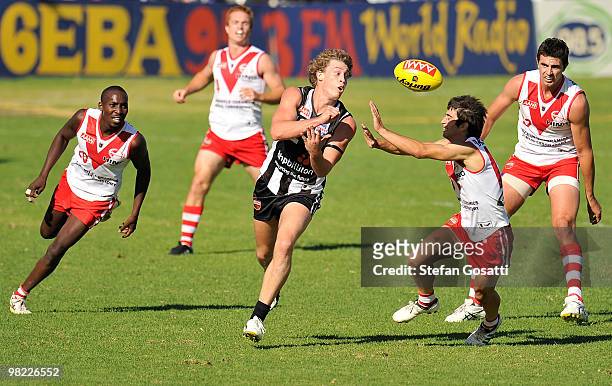 Matt Riggio of Swan Districts handballs during the round three WAFL match between Swan Districts and South Fremantle at Steel Blue Oval on April 3,...
