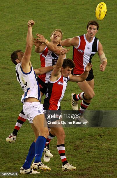 Hamish McIntosh of the Kangaroos spoils a mark by Nick Riewoldt of the Saints during the round two AFL match between the St Kilda Saints and the...