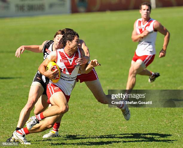 Corry Amato of South Fremantle breaks a tackle during the round three WAFL match between Swan Districts and South Fremantle at Steel Blue Oval on...