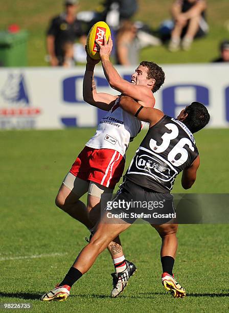 Kyle Hams of South Fremantle takes a mark from Clancee Pearce of the Swan Districts during the round three WAFL match between Swan Districts and...