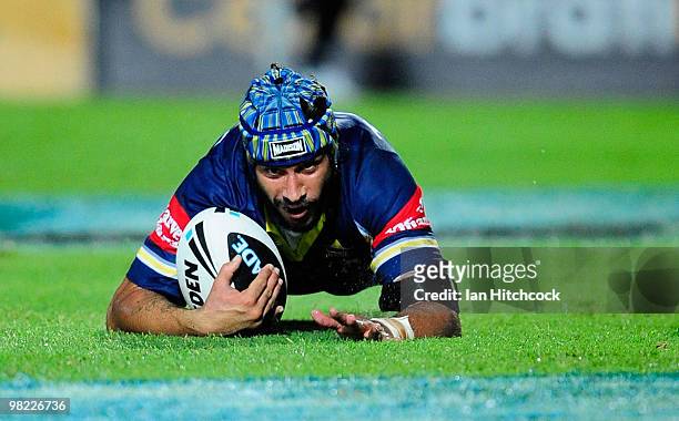 Johnathan Thurston of the Cowboys scores a try during the round four NRL match between the North Queensland Cowboys and the Gold Coast Titans at...