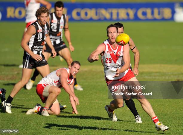 Chris Bossong of South Fremantle handballs away during the round three WAFL match between Swan Districts and South Fremantle at Steel Blue Oval on...