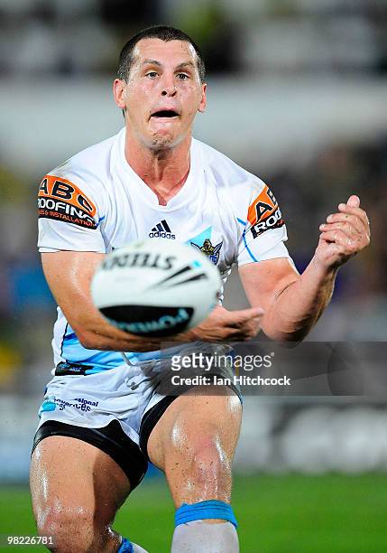 Greg Bird of the Titans passes the ball during the round four NRL match between the North Queensland Cowboys and the Gold Coast Titans at Dairy...