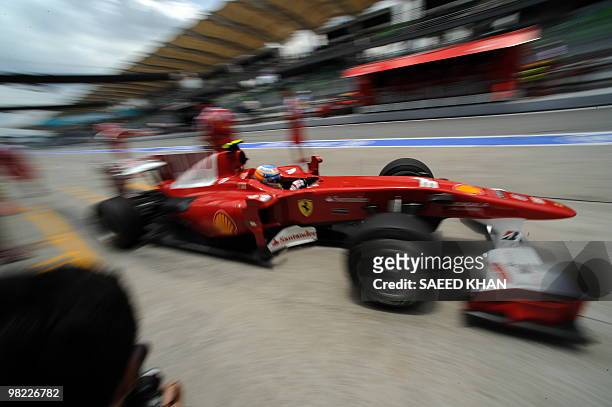 Ferrari driver Fernando Alonso of Spain leaves the pit during third practice session for Formula One's Malaysian Grand Prix in Sepang on April 3,...