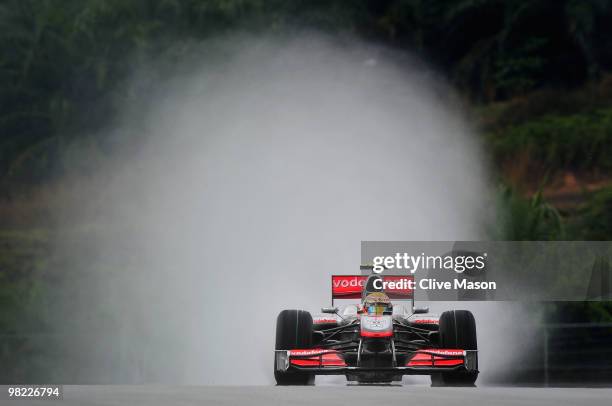 Lewis Hamilton of Great Britain and McLaren Mercedes drives during qualifying for the Malaysian Formula One Grand Prix at the Sepang Circuit on April...