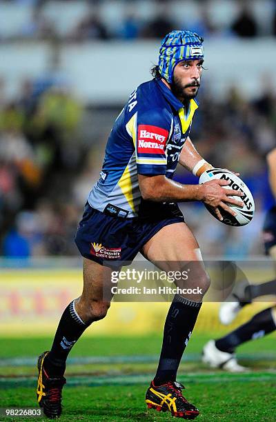 Johnathan Thurston of the Cowboys runs the ball during the round four NRL match between the North Queensland Cowboys and the Gold Coast Titans at...