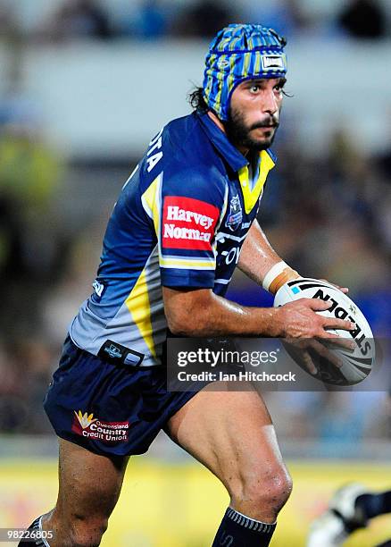 Johnathan Thurston of the Cowboys runs the ball during the round four NRL match between the North Queensland Cowboys and the Gold Coast Titans at...
