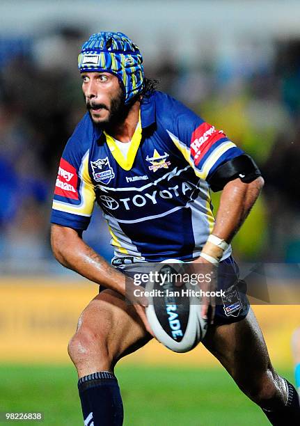 Johnathan Thurston of the Cowboys runs the ball during the round four NRL match between the North Queensland Cowboys and the Gold Coast Titans at...