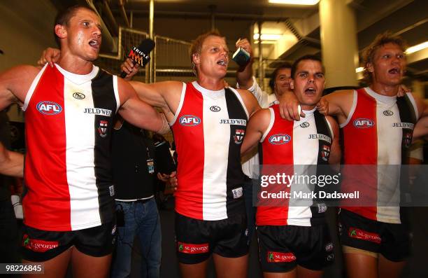 Michael Gardiner, Nick Riewoldt, Brett Peake and Sam Gilbert sing the team song after winning the round two AFL match between the St Kilda Saints and...