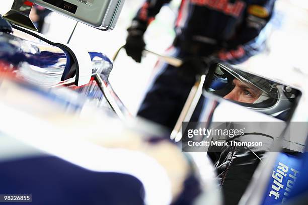 Sebastian Vettel of Germany and Red Bull Racing prepares to drive during qualifying for the Malaysian Formula One Grand Prix at the Sepang Circuit on...