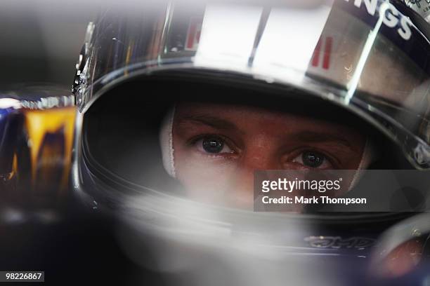 Sebastian Vettel of Germany and Red Bull Racing prepares to drive during qualifying for the Malaysian Formula One Grand Prix at the Sepang Circuit on...