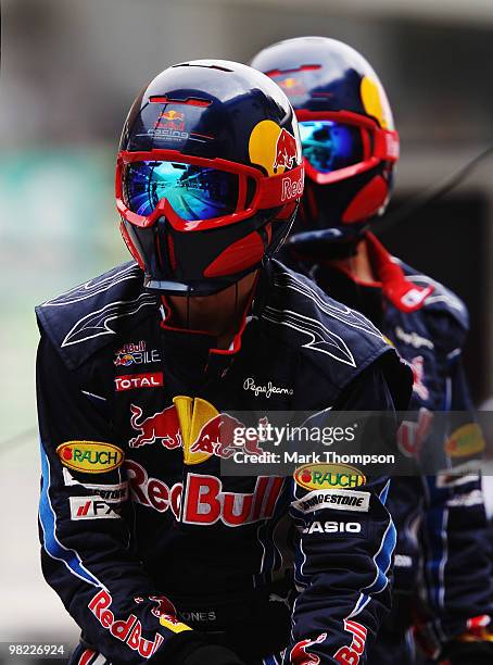 Red Bull Racing mechanics are seen during qualifying for the Malaysian Formula One Grand Prix at the Sepang Circuit on April 3, 2010 in Kuala Lumpur,...