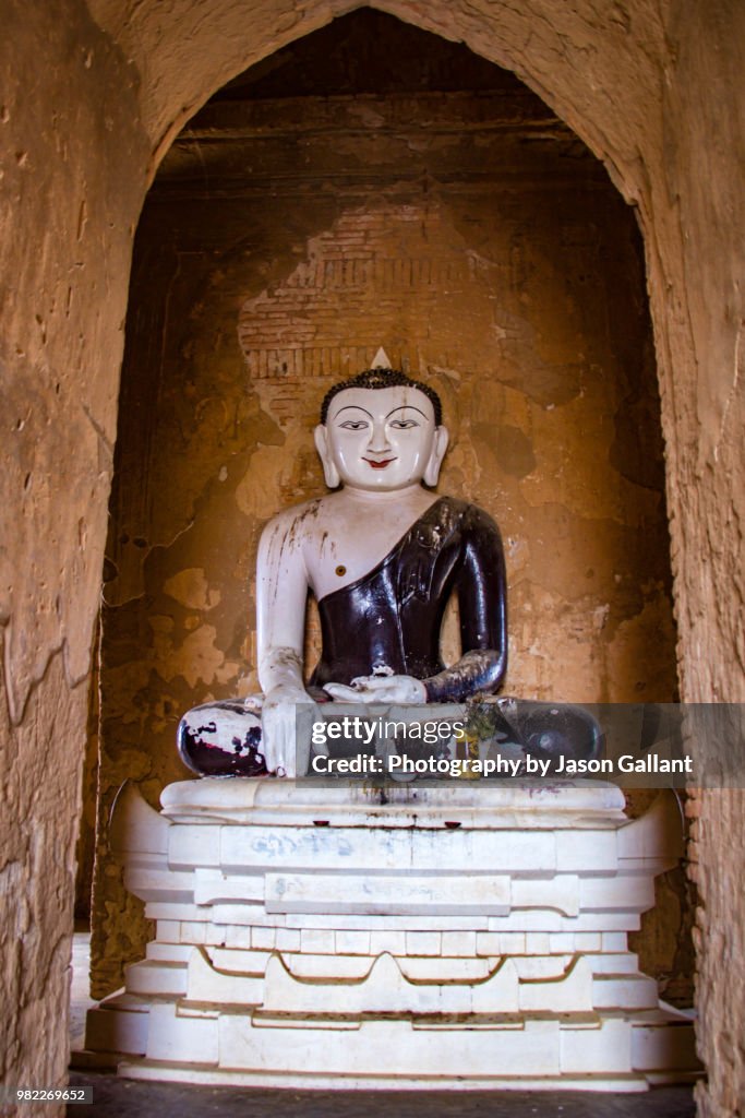 Buddha statue inside a temple in Bagan, Myanmar.