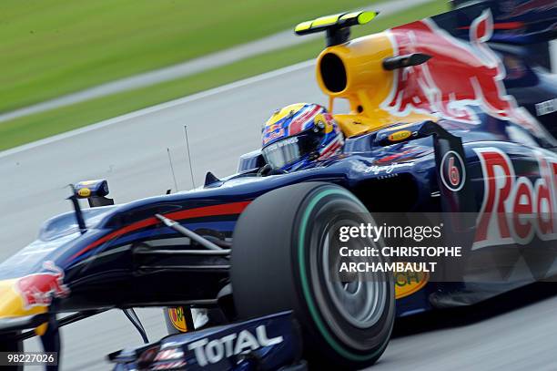 Red Bull-Renault driver Mark Webber of Australia powers his car during the third practice session for Formula One's Malaysian Grand Prix in Sepang on...