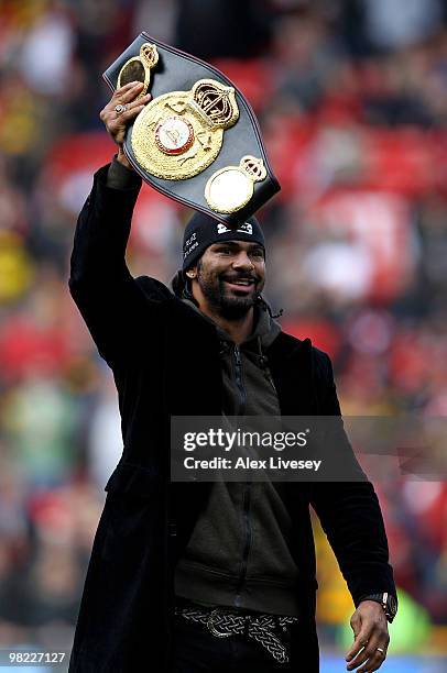 Boxer David Haye shows off his WBA Heavyweight champion's belt to the crowd prior to the Barclays Premier League match between Manchester United and...