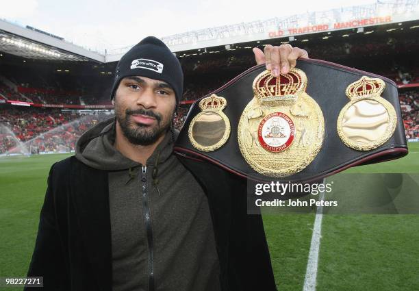 Heavyweight boxing Champion of the World David Haye poses with his belt ahead of the FA Barclays Premier League match between Manchester United and...