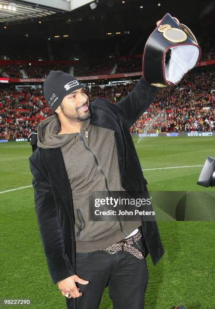 Heavyweight boxing Champion of the World David Haye poses with his belt ahead of the FA Barclays Premier League match between Manchester United and...