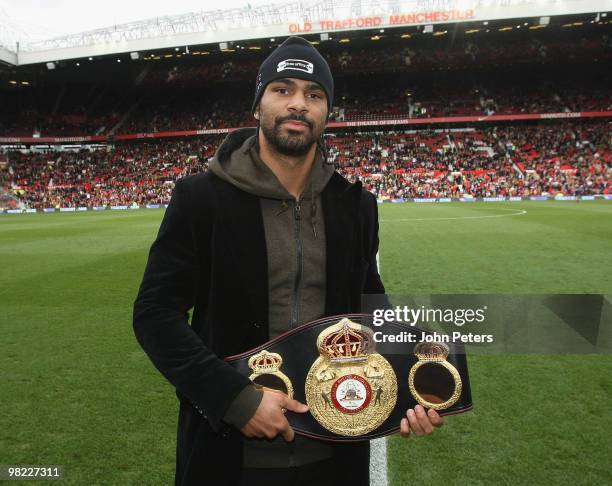 Heavyweight boxing Champion of the World David Haye poses with his belt ahead of the FA Barclays Premier League match between Manchester United and...