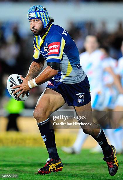 Johnathan Thurston of the Cowboys runs the ball during the round four NRL match between the North Queensland Cowboys and the Gold Coast Titans at...