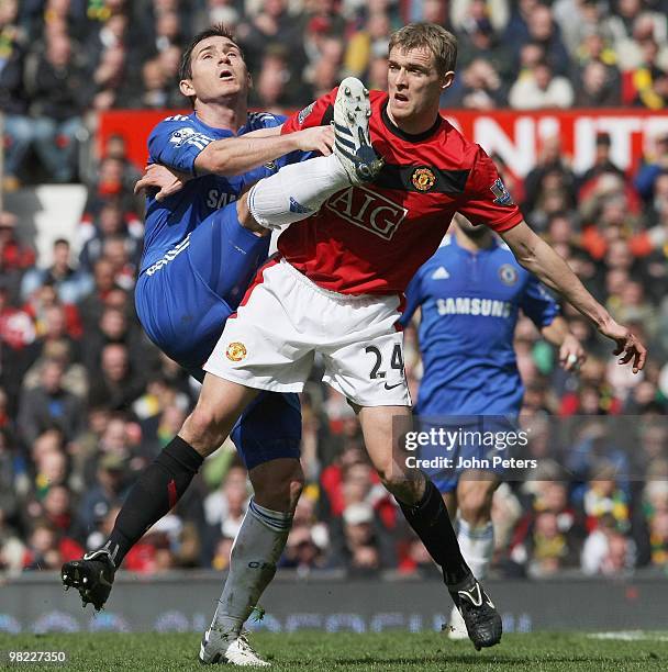 Frank Lampard of Chelsea competes for the ball with Darren Fletcher of Manchester United during the FA Barclays Premier League match between...