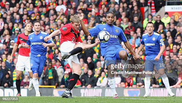 Darren Fletcher of Manchester United is challenged by Florent Malouda of Chelsea during the FA Barclays Premier League match between Manchester...