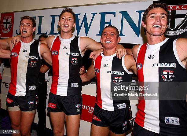 David Armitage, Zac Dawson, Steven Baker and Lenny Hayes of the Saints sing the team song after winning the round two AFL match between the St Kilda...