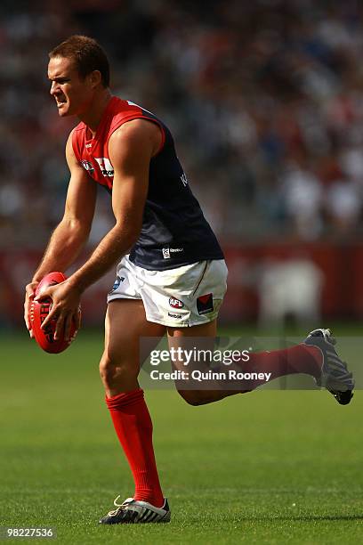 Brad Green of the Demons kicks during the round two AFL match between the Collingwood Magpies and the Melbourne Demons at the Melbourne Cricket...