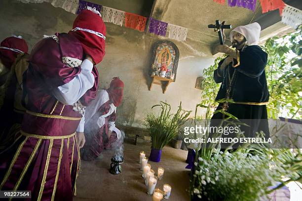 Actors perform the Via Crucis on April 1, 2010 in Tzintzuntzan community in Morelia, Mexico. The actors are called "Espias" , and ride around the...