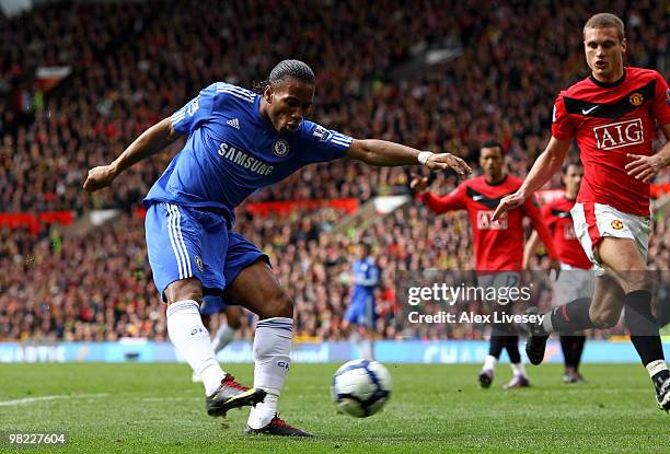 Didier Drogba of Chelsea scores his team's second goal during the Barclays Premier League match between Manchester United and Chelsea at Old Trafford...