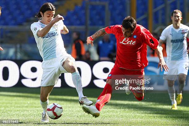 Giuseppe Biava of SS Lazio and Ivan Ezequiel Lavezzi of SSC Napoli compete for the ball during the Serie A match between SS Lazio and SSC Napoli at...