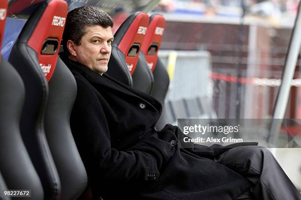 Herbert Fandel, former FIFA referee and upcoming referee supervisor of the DFB sits on the substitution bench before the Bundesliga match between...