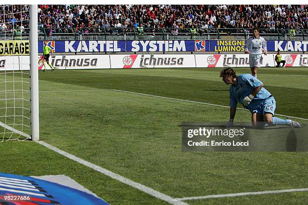 Marchetti of Caglairi looks at the goal of Boriello during the Serie A match between Cagliari Calcio and AC Milan at Stadio Sant'Elia on April 3,...