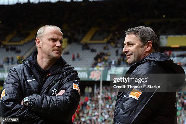 Manager Klaus Allofs of Bremen talks to head coach Thomas Schaaf prior to the Bundesliga match between Borussia Dortmund and SV Werder Bremen at...