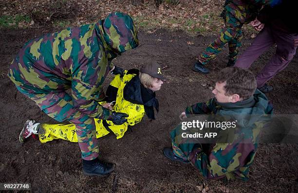 Activists are arrested during a bomb spotting action of Belgian pacifist peace organisation Vredesactie at the military base of Kleine Brogel April...