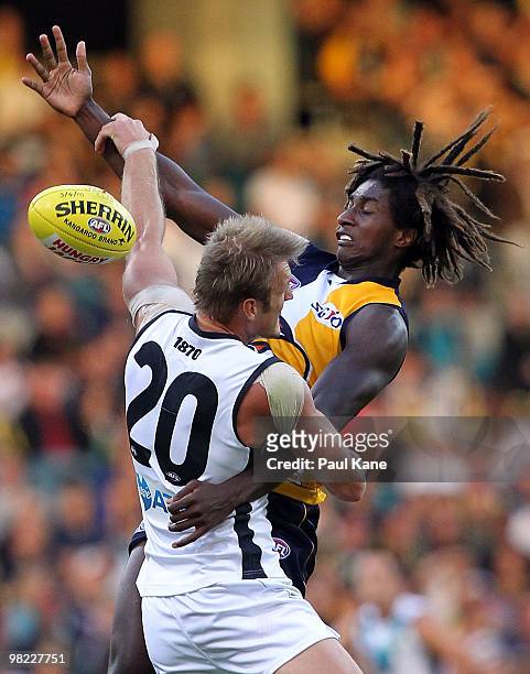 Nic Naitanui of the Eagles and Dean Brogan of the Power contest the ruck during the round two AFL match between the West Coast Eagles and Port...