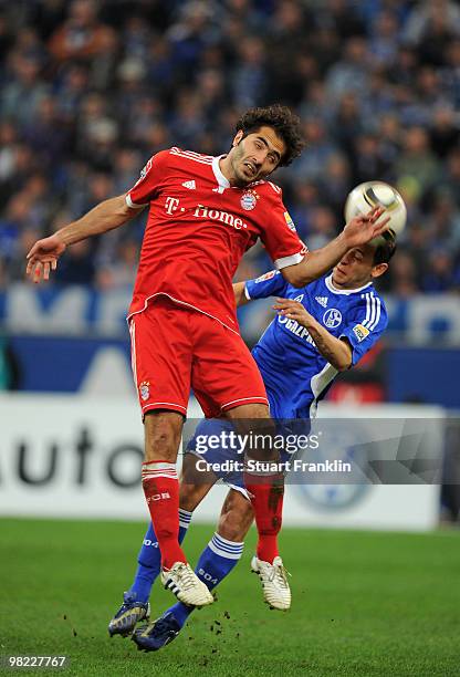 Hamit Altintop of Bayern is challenged by Rafinha of Schalke during the Bundesliga match between FC Schalke 04 and FC Bayern Muenchen at the Veltins...