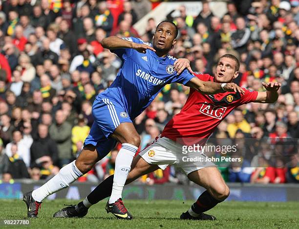 Nemanja Vidic of Manchester United clashes with Didier Drogba of Chelsea during the FA Barclays Premier League match between Manchester United and...