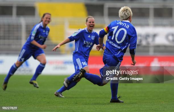 Ivonne Hartmann of Jena celebrates the first goal with teammates during the DFB women's cup half final match between FF USV Jena and SG...