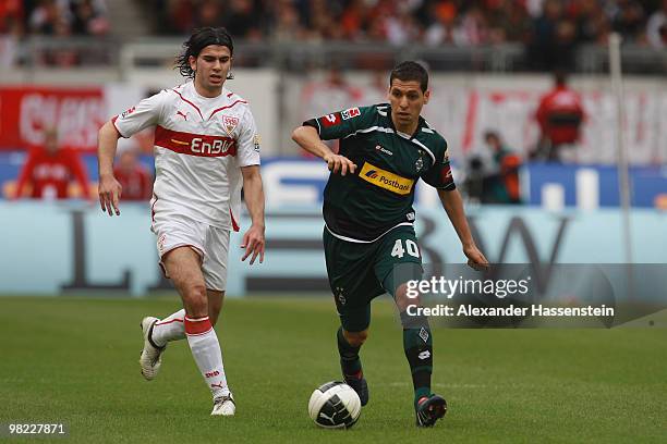 Karim Matmour of Gladbach battles for the ball with Serdar Tasci of Stuttgart during the Bundesliga match between VfB Stuttgart and Borussia...