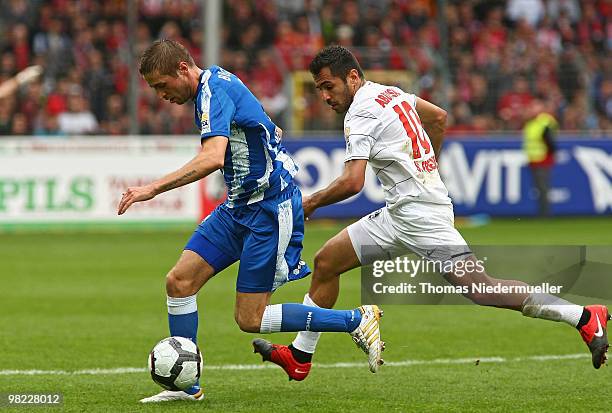 Yacine Abdessadki of Freiburg fights for the ball with Stanislav Sestak of Bochum during the Bundesliga match between SC Freiburg and VfL Bochum at...