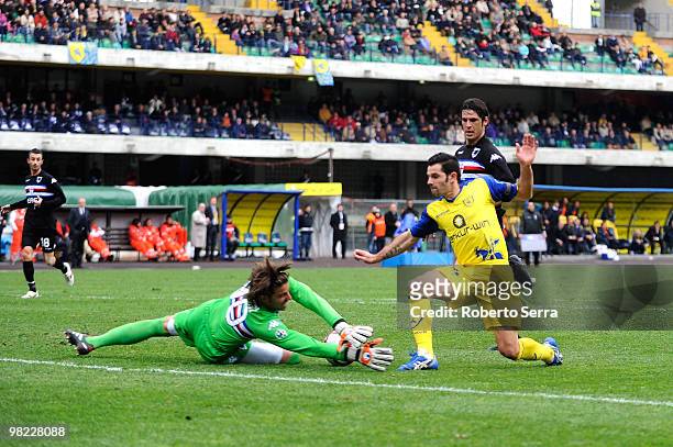 Sergio Pellissier of Chievo competes with Marco Storari goal keeper of Sampdoria during the Serie A match between AC Chievo Verona and UC Sampdoria...