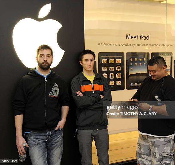 Customers wait in line to be one of the first to buy the iPad at the Apple Store at West Farms Mall in Farmington, Connecticut, on April 3, 2010....