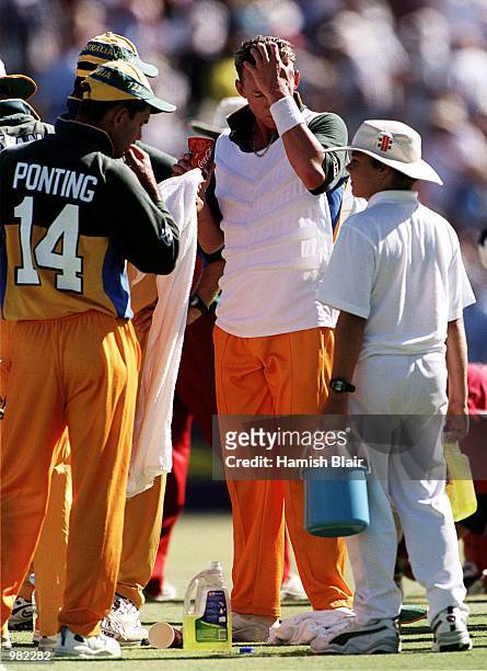 Brett Lee of Australia wears a special cooling vest during a drinks break as temperatures soar during the Carlton Series One Day International...