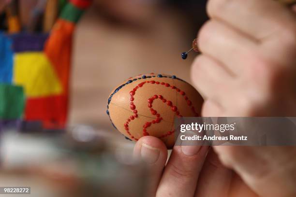 Ute Henschel paints an easter egg in traditional Sorbian motives on the season opening of the open-air museum Lehde on April 3, 2010 in Lehde, near...